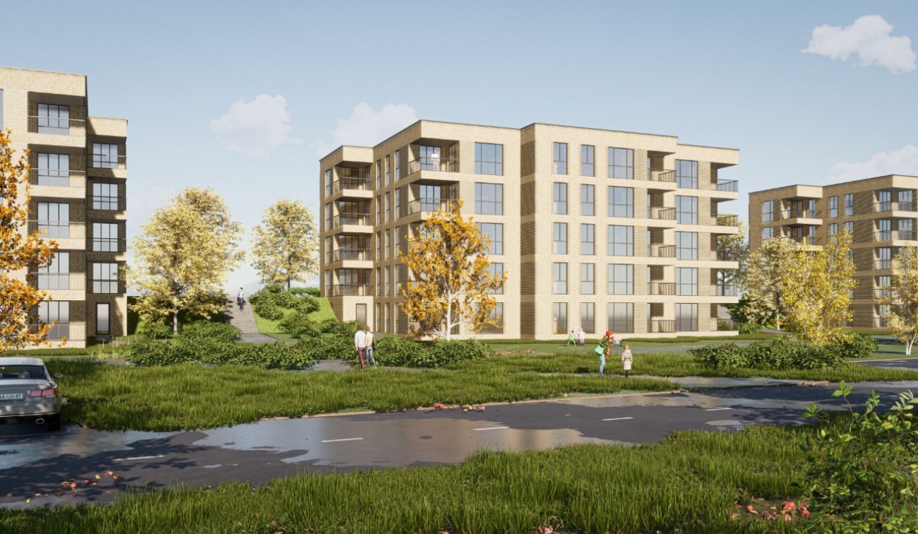 Impressie van het nieuwbouwproject De Jonkvrouw in Geldrop, met weelderig groen en beplanting rondom het appartementencomplex.