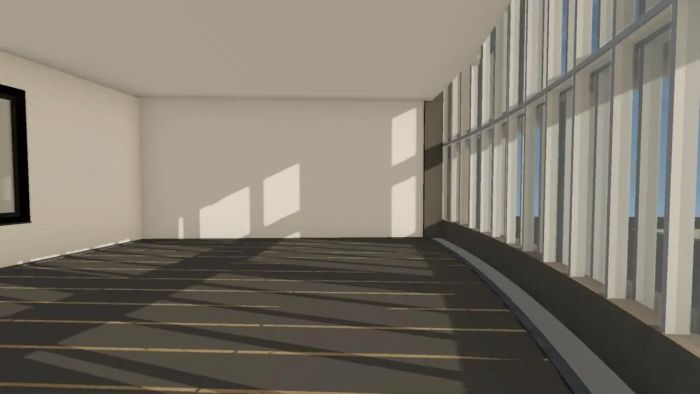 Interieurimpressie van lichte multifunctionele ruimte met grote raamstrook en daglichtinval.