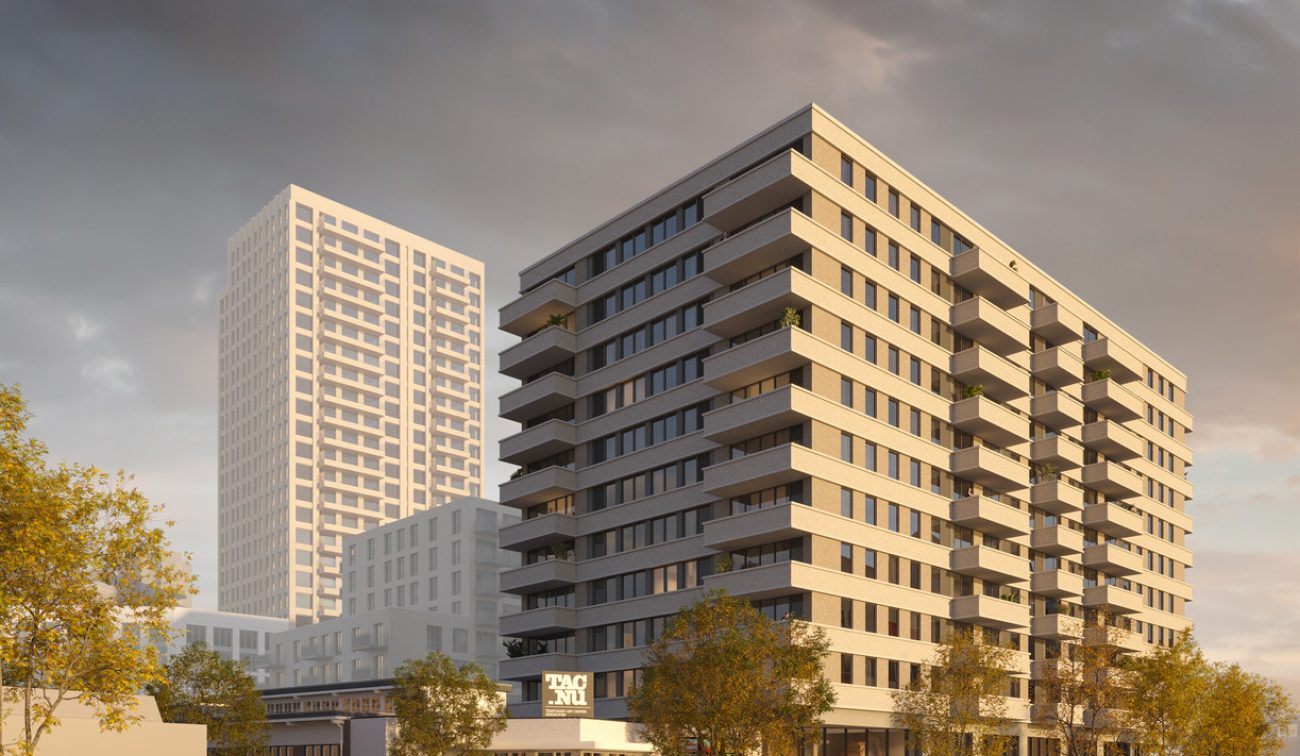Close-up impressie van de nieuwbouwtoren bij het TAC-terrein in Eindhoven, met moderne gevels, balkons en een warme avondlichtinval.