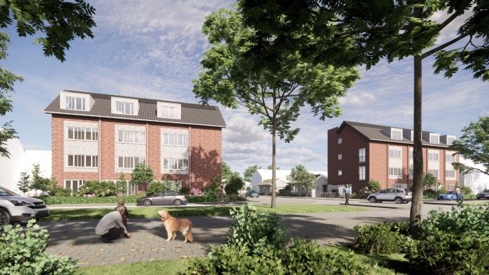 Impressie van de zijkant van het nieuwbouwproject Voetnoodt met het appartementencomplex en naastgelegen bungalows in een groene omgeving