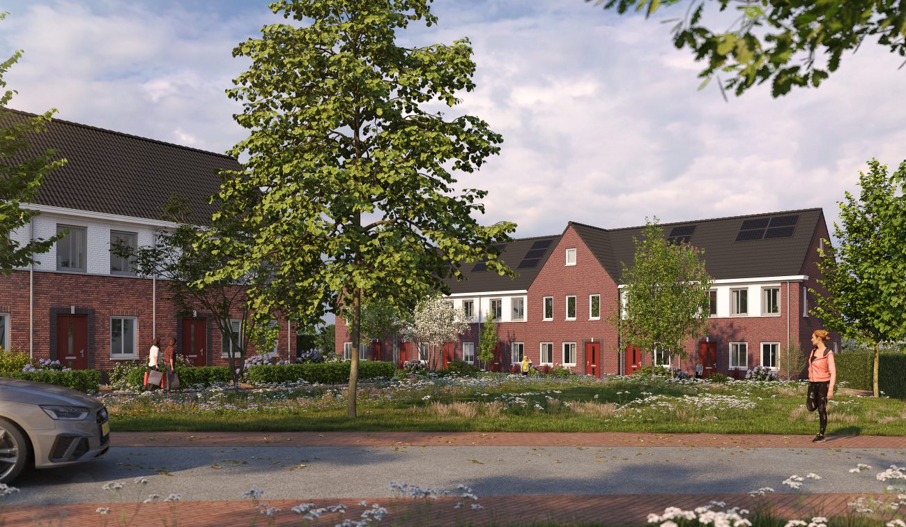 Overdagimpressie van de rijtjeswoningen in het nieuwbouwproject De Bloesemgaard in Margraten, met moderne gevels en groene voortuinen.