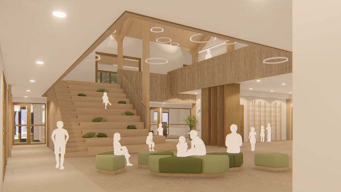 Binnenruimte nieuwbouw SKC Berg en Terblijt met houten lamellen, brede traptribune en zitblokken