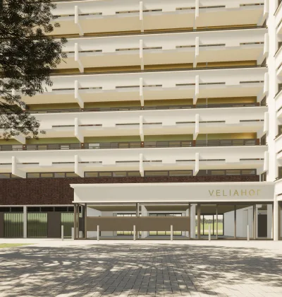Appartementencomplex Veliahof met gestapelde balkons en overdekte entree aan binnenplaats